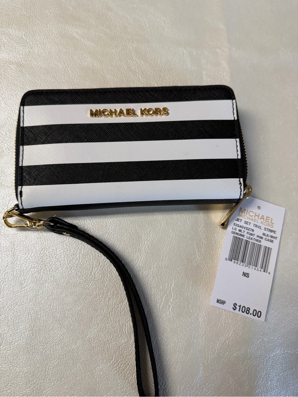 Michael Kors Black and White Striped Wristlet with Gold Logo